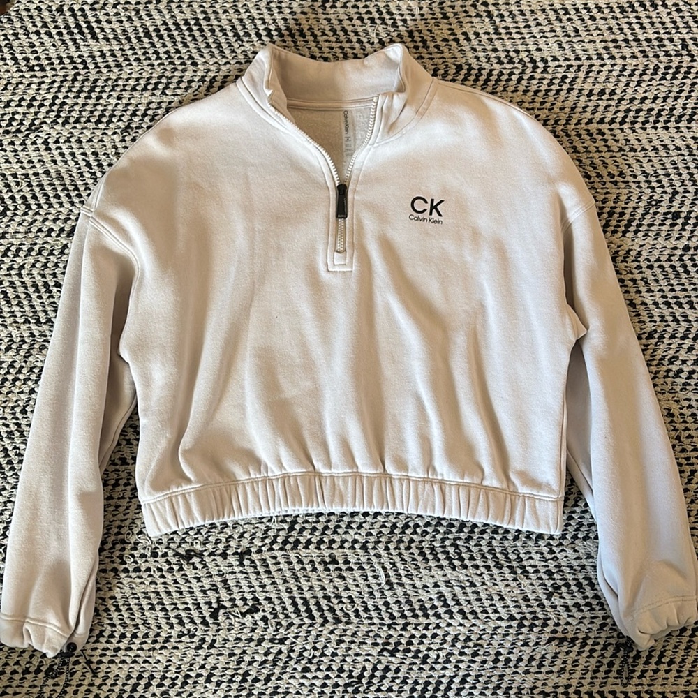 Calvin Klein pullover sweatshirt with adjustable sleeve length.